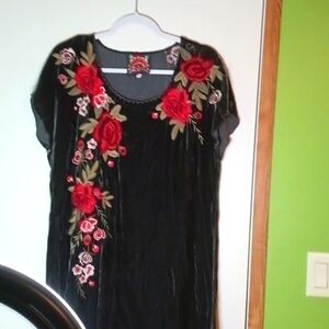 Johnny was size small black Velveteen like feeling material. Size S